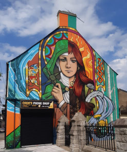 Hard enamel pin based on artist Marian Noone’s (Friz) mural artwork in Dundalk titled, Brigid of Faughart