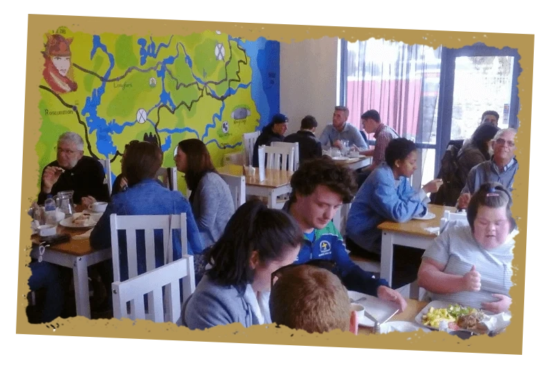 Group of people having meal at tain cafe